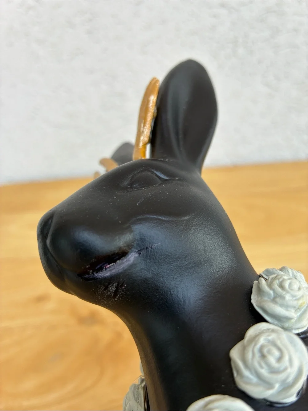 Black ceramic jackalope!  With gold horns snd grey rose necklace!  Bunmy figure